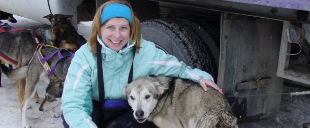 Theresa bonding with the Alaskan huskies after dog-sledding in Lake Louise, Banff National Park, in Alberta, Canada.